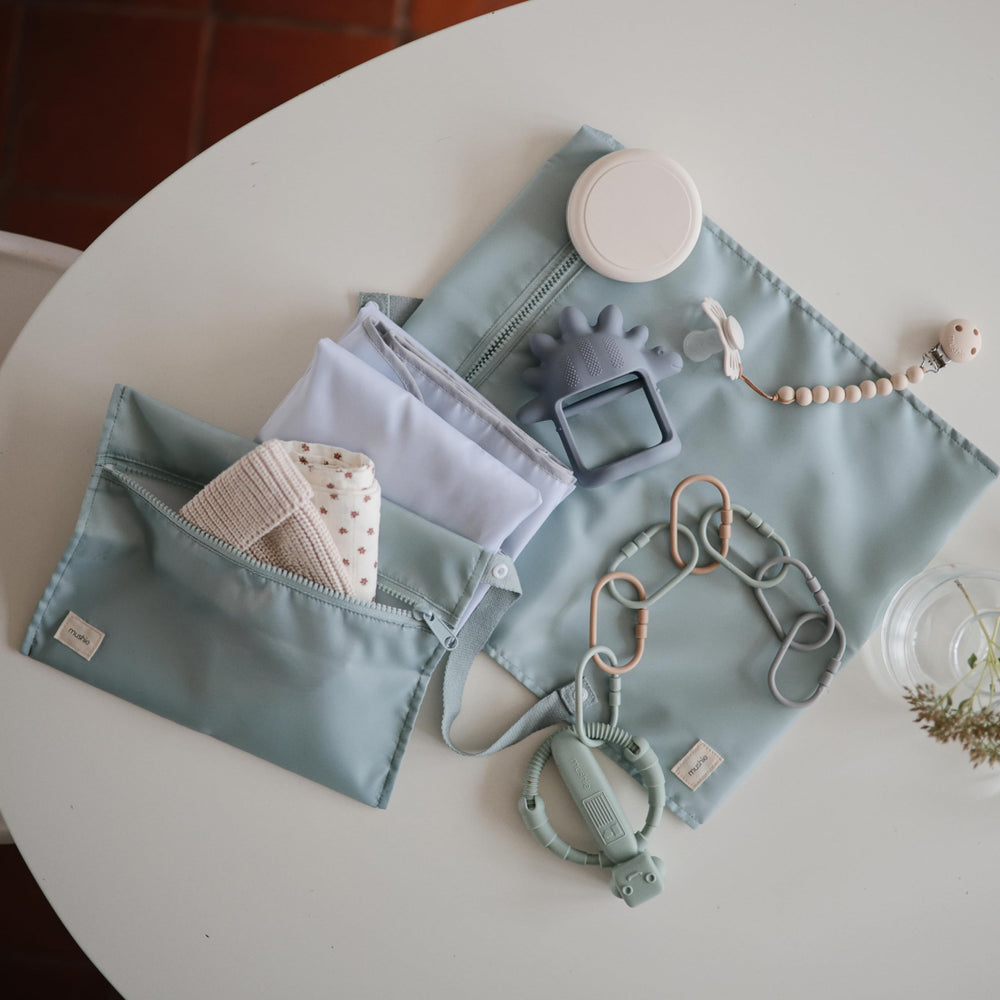 Mushie machine washable bag for quick cleanups after messes.