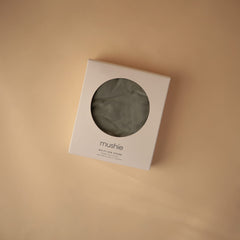 Mushie multi-use cover for nursing provides cool comfort during feeding.