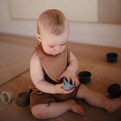 mushie muslin bib multi-layer fabric absorbs spills during feeding