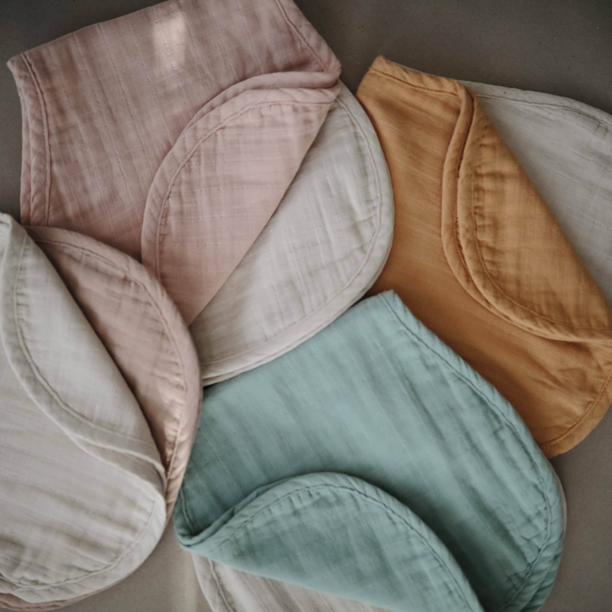 Mushie Muslin Burp Cloths set of 2 in Roman Green and Fog colors.