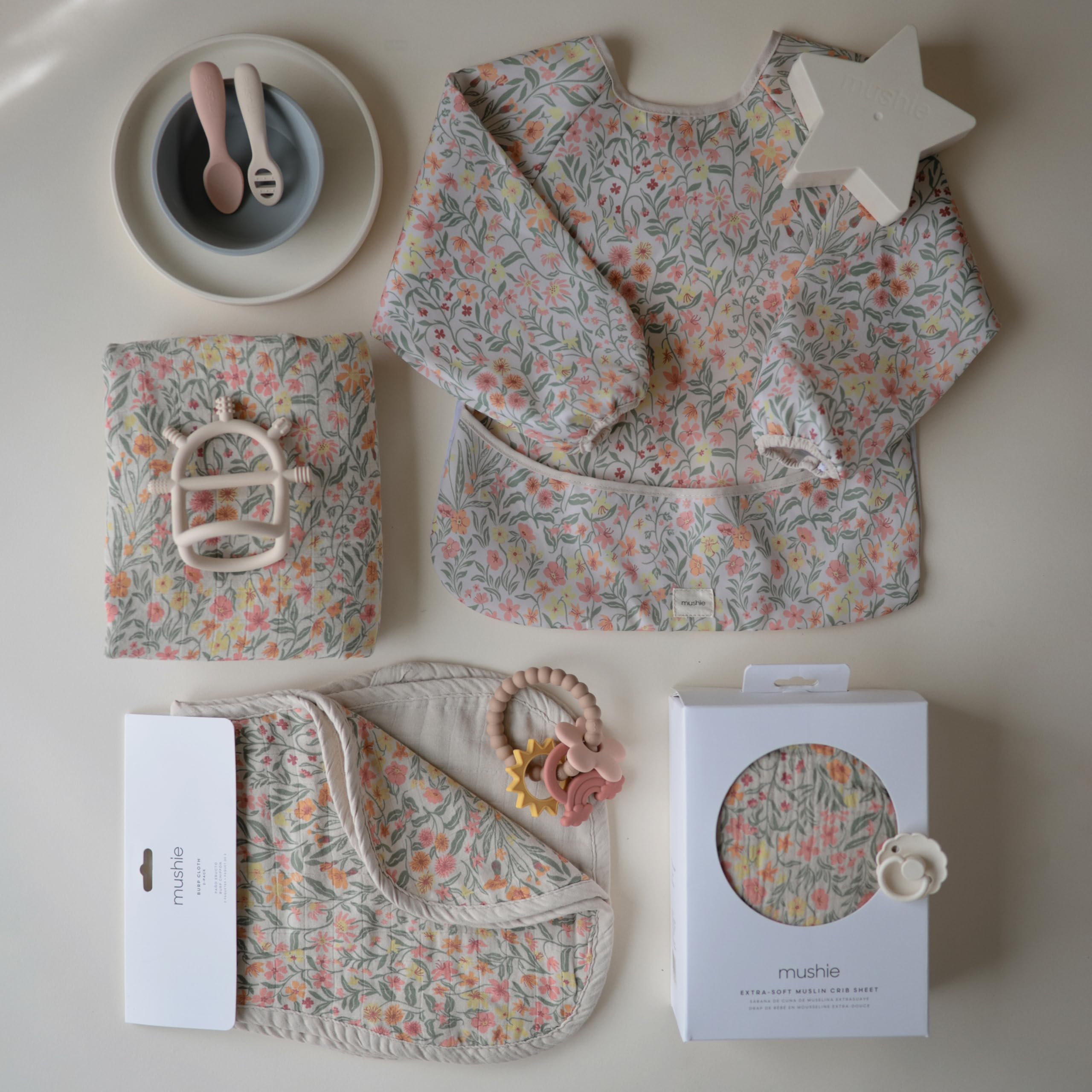 Mushie muslin burp cloths care-instructions-spot-clean image with machine-wash guidance.