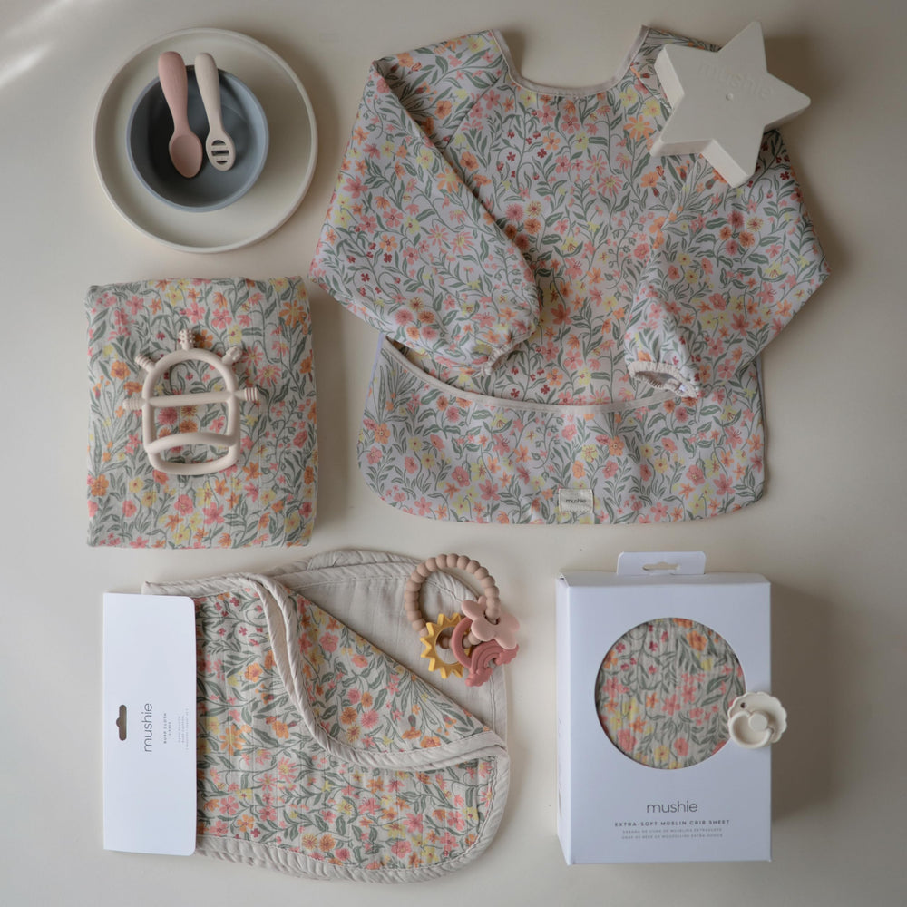 Mushie muslin burp cloths care-instructions-spot-clean image with machine-wash guidance.