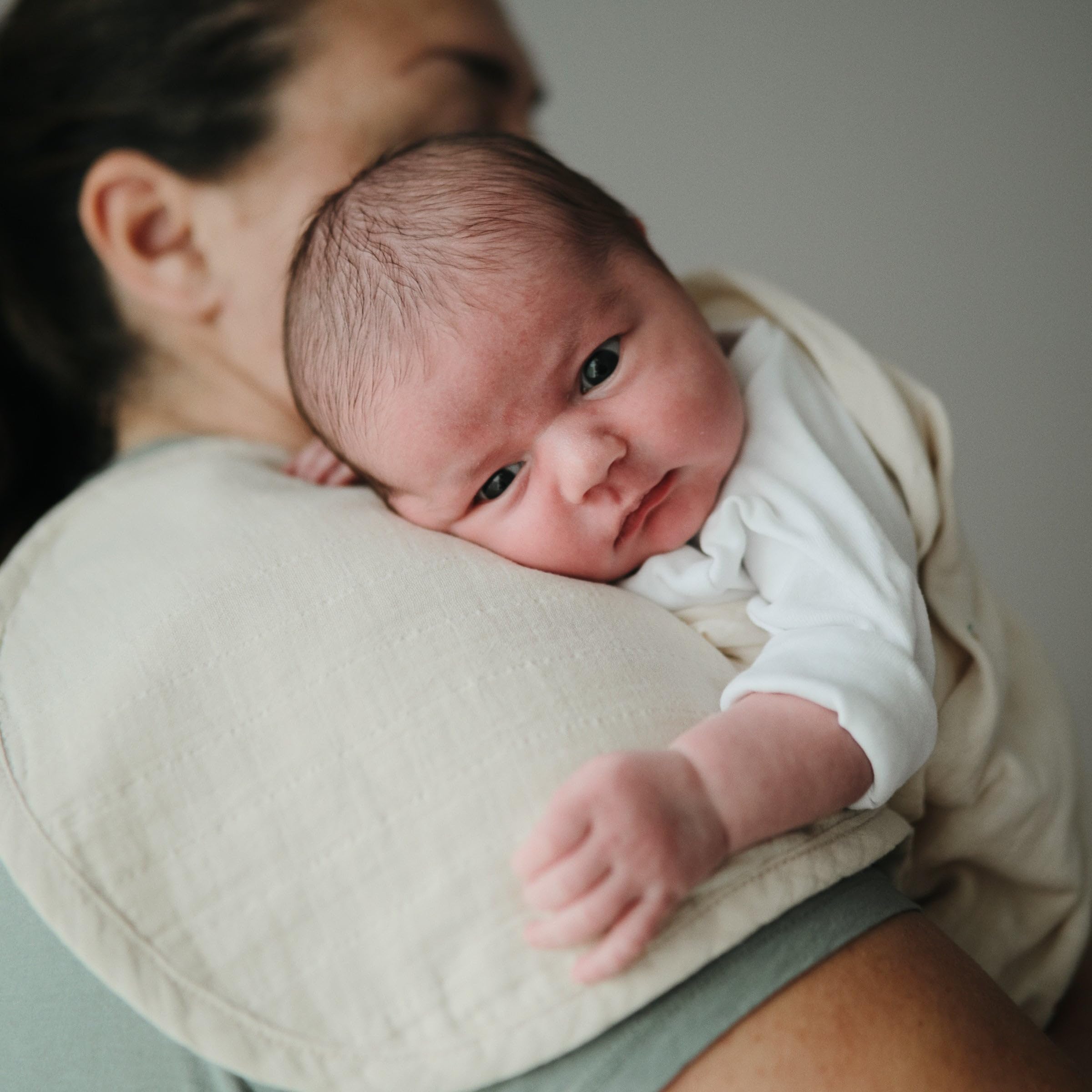 Mushie muslin burp cloths handy for wipes during meals and play.