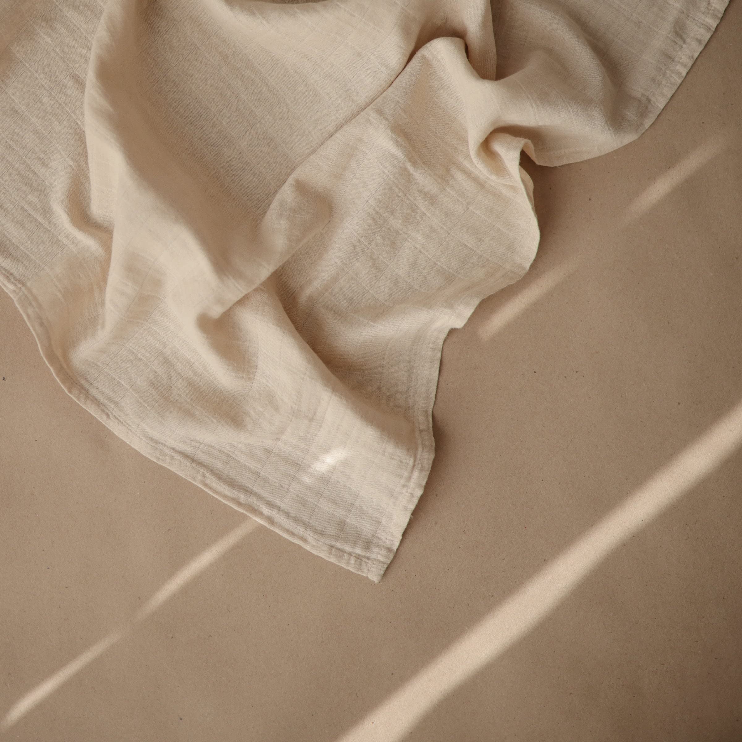 Mushie Muslin Cloth Fog folded neatly highlights breathable fabric ideal for mess cleanups