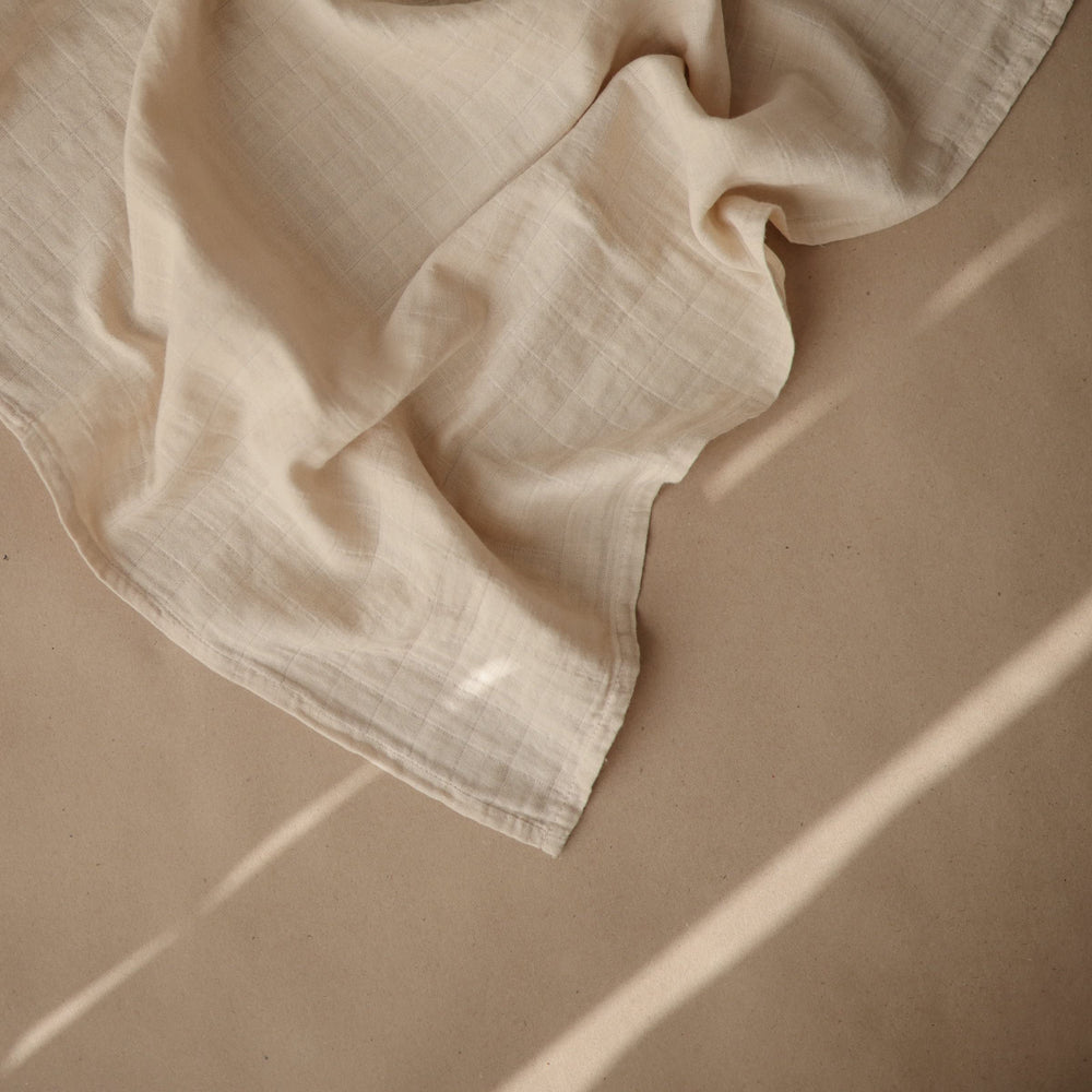 Mushie Muslin Cloth Fog folded neatly highlights breathable fabric ideal for mess cleanups