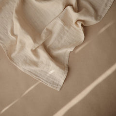 Mushie Muslin Cloth Fog folded neatly highlights breathable fabric ideal for mess cleanups