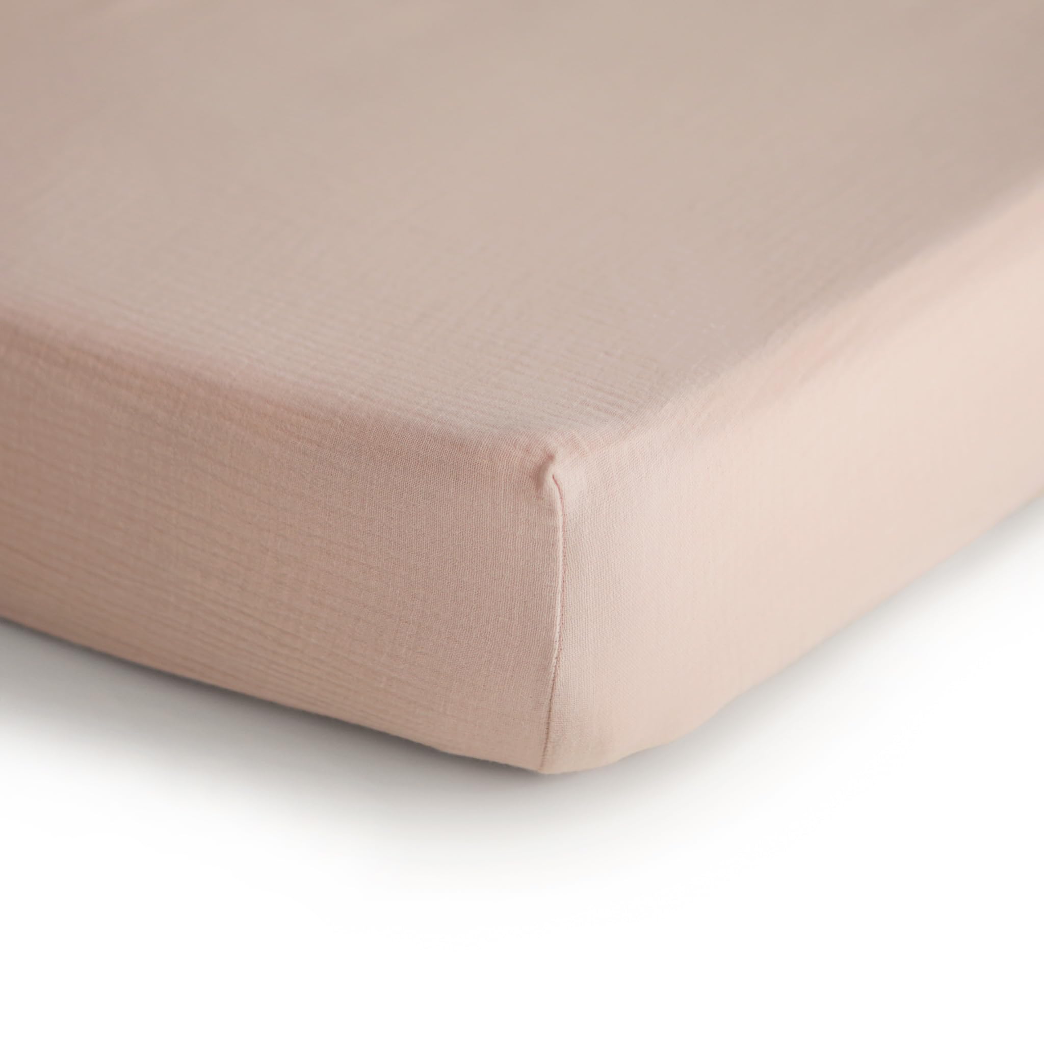 mushie muslin crib sheet blush texture detail highlighting breathable fabric for comfortable naps