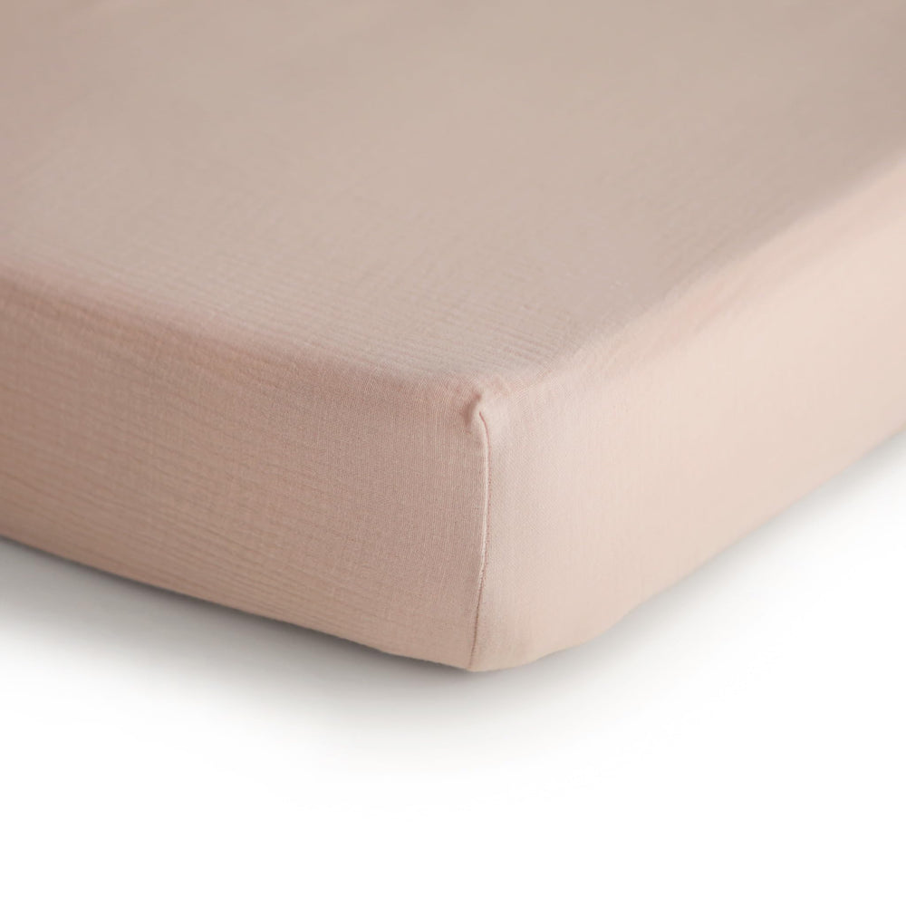 mushie muslin crib sheet blush texture detail highlighting breathable fabric for comfortable naps