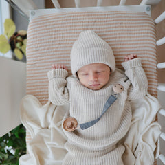 Mushie breathable cotton muslin sheet highlights breathable softness for baby
