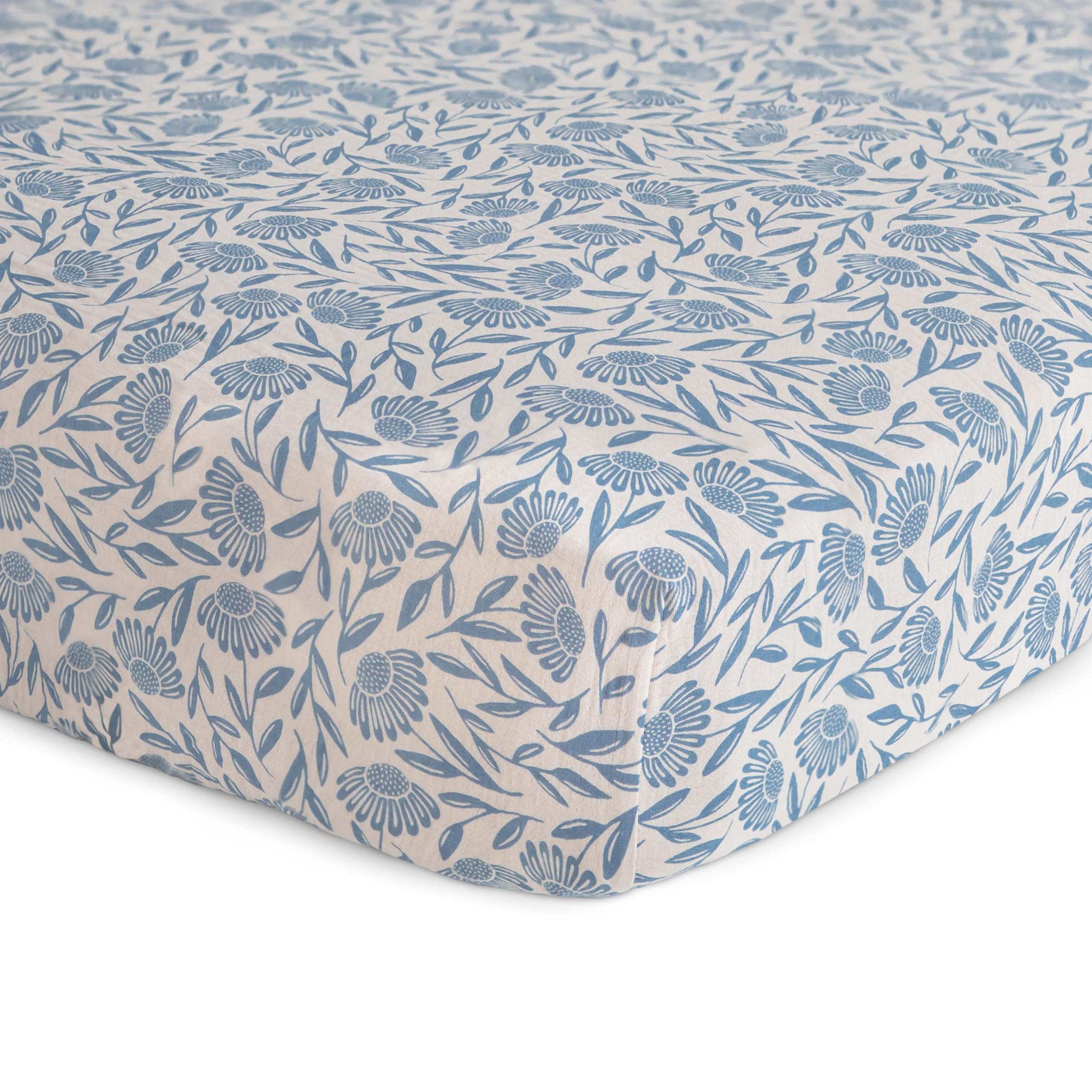 Mushie muslin crib sheet elastic edges ensure quick changes and secure fit