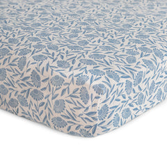 Mushie muslin crib sheet elastic edges ensure quick changes and secure fit