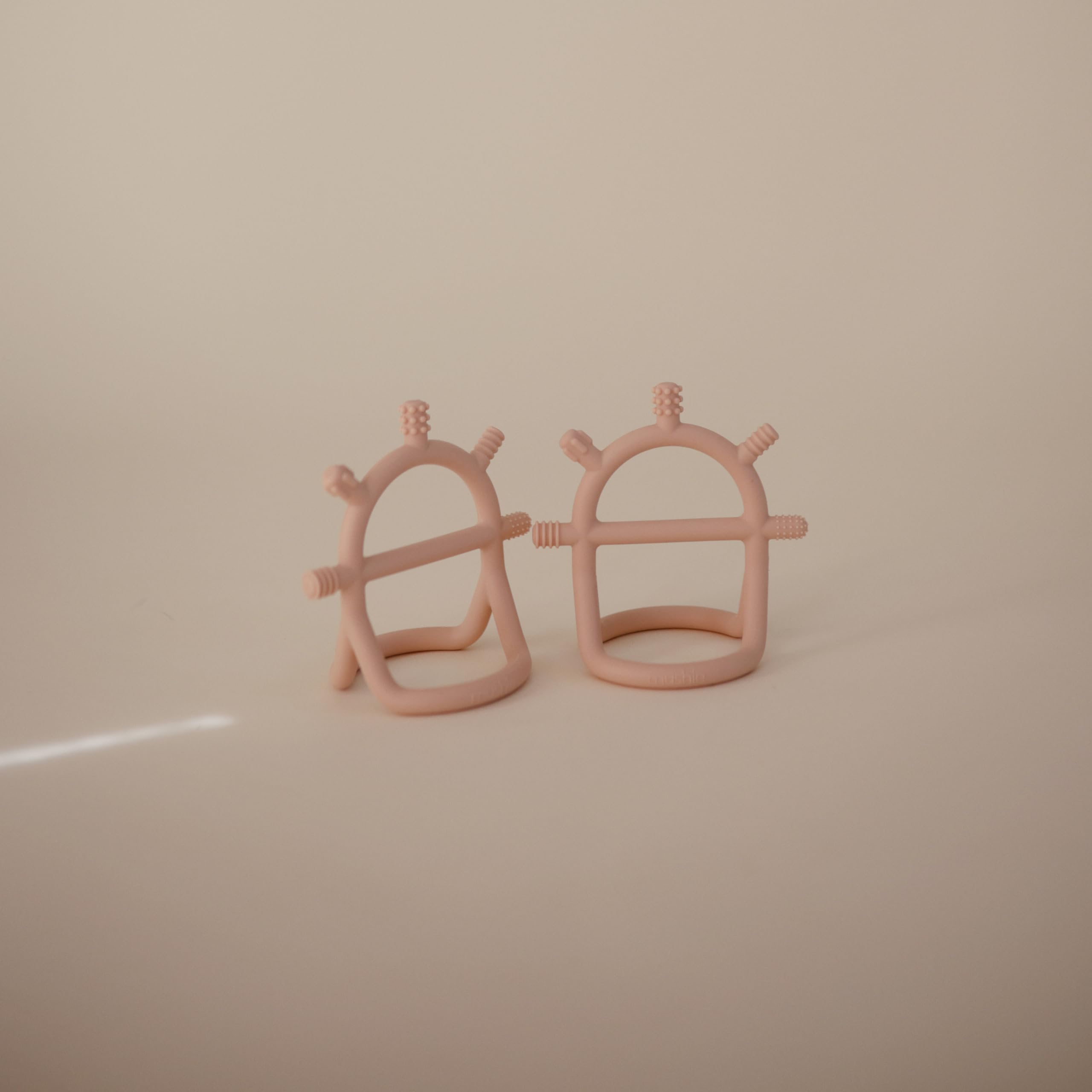 mushie No-Drop teether blush soft silicone supports safe chewing