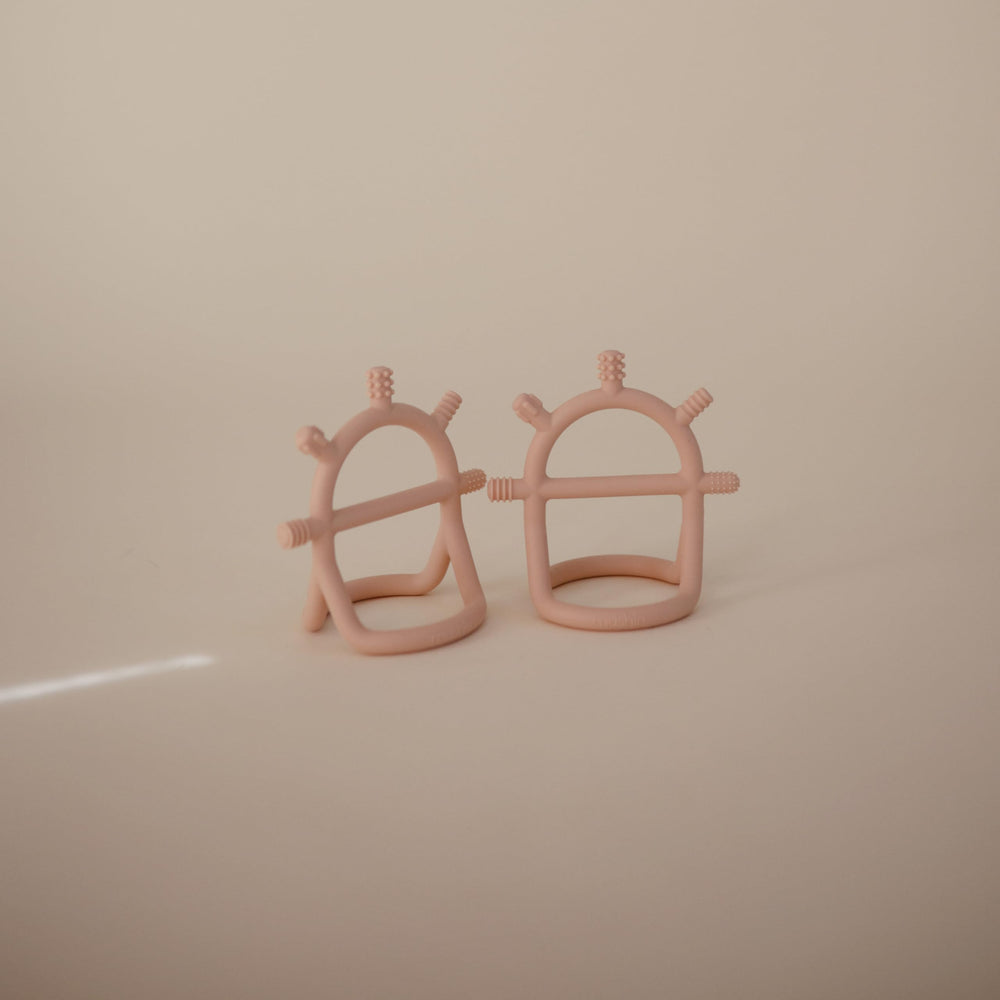 mushie No-Drop teether blush soft silicone supports safe chewing