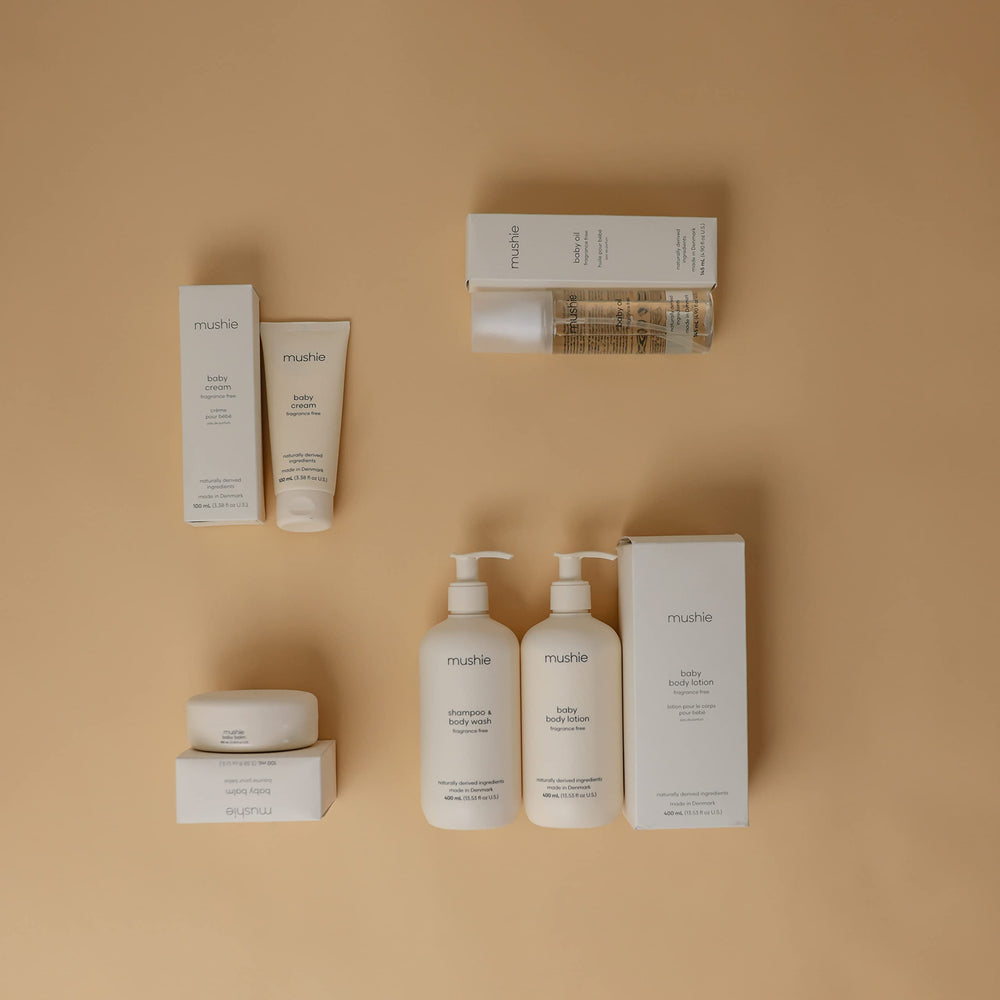 Mushie Organic Baby Oil drops on skin capture gentle, fast-absorbing texture for everyday routines.