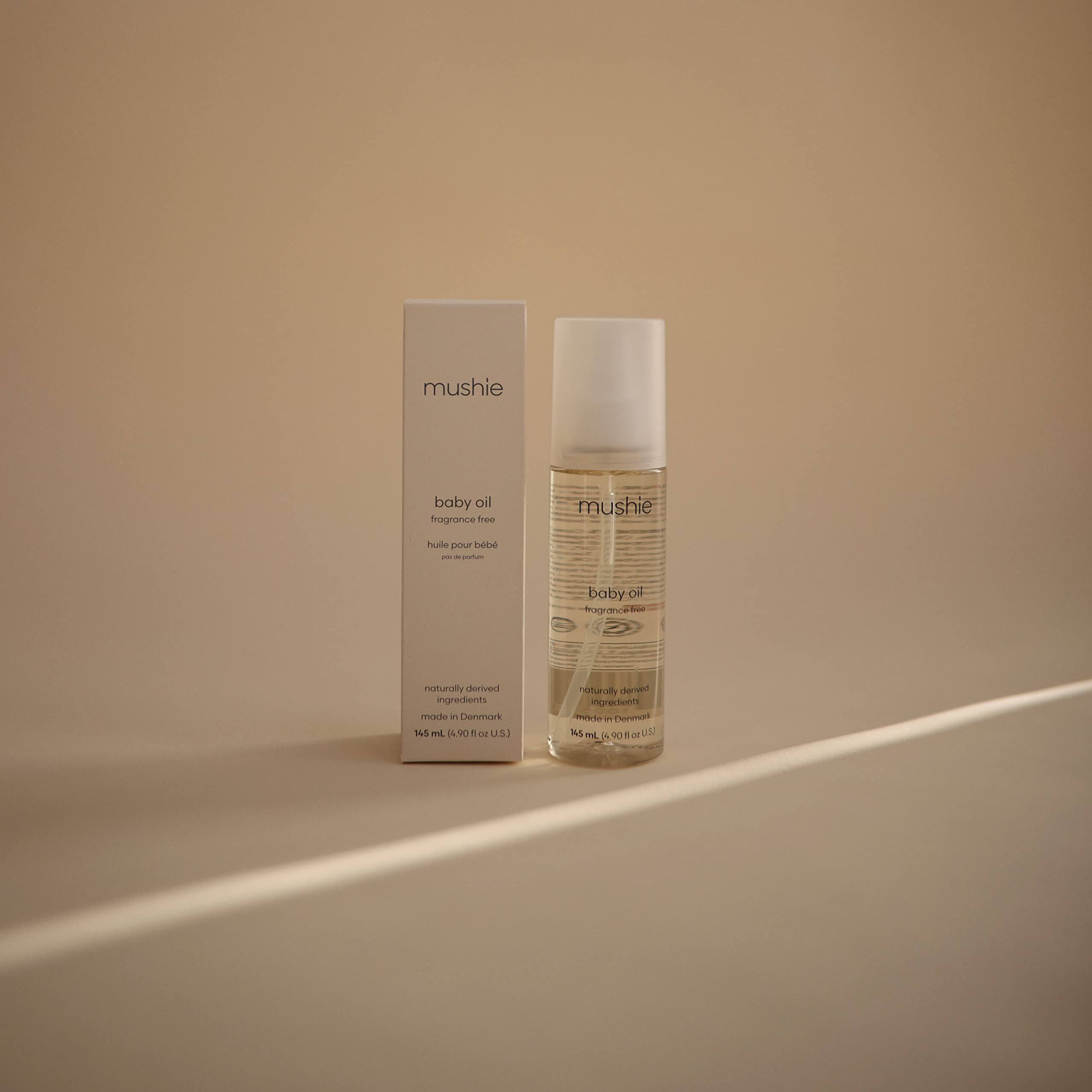 Mushie Organic Baby Oil ingredients COSMOS label highlights certified organic care for sensitive skin.