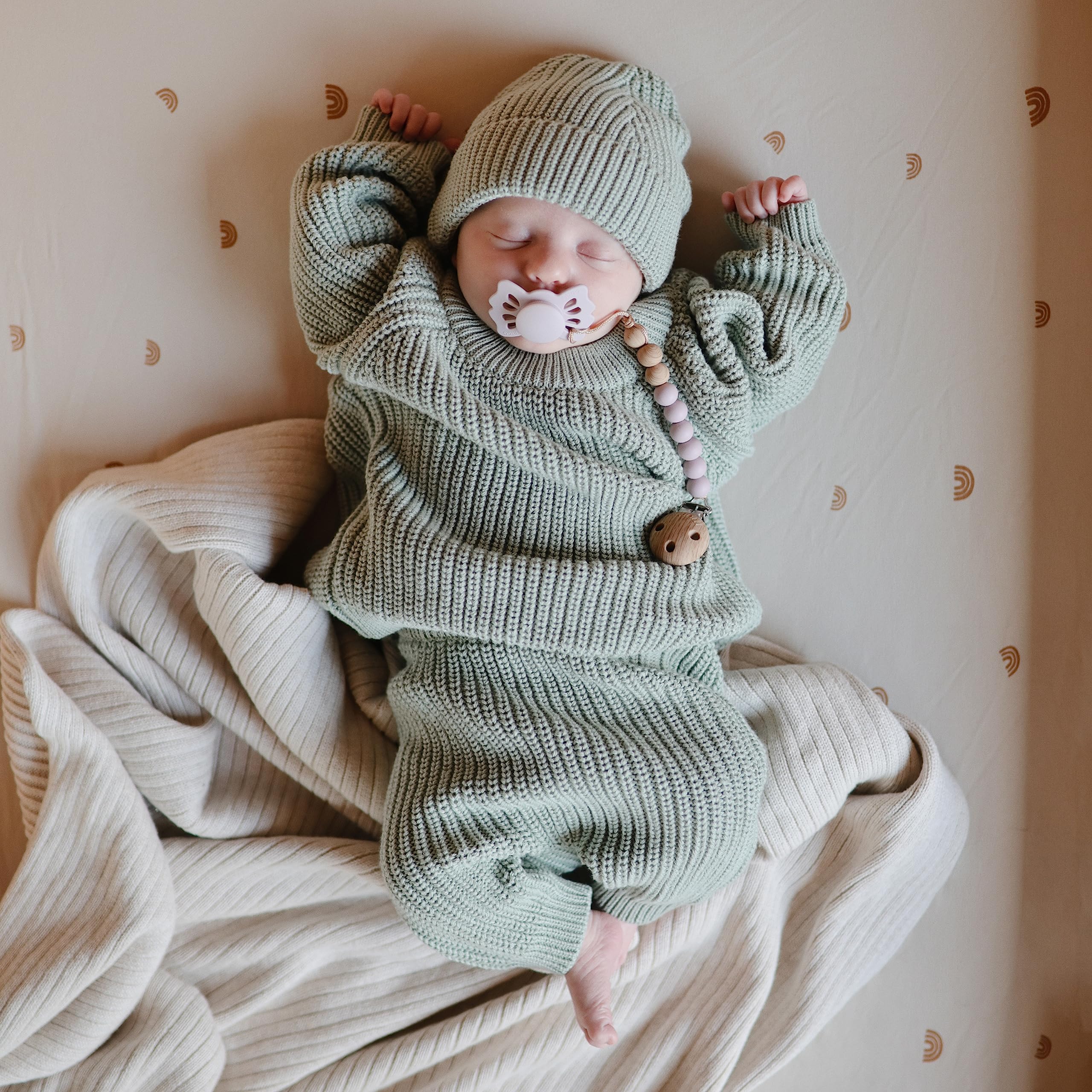 Mushie organic cotton bassinet sheet Rainbows soft-touch fabric for baby calm nights.