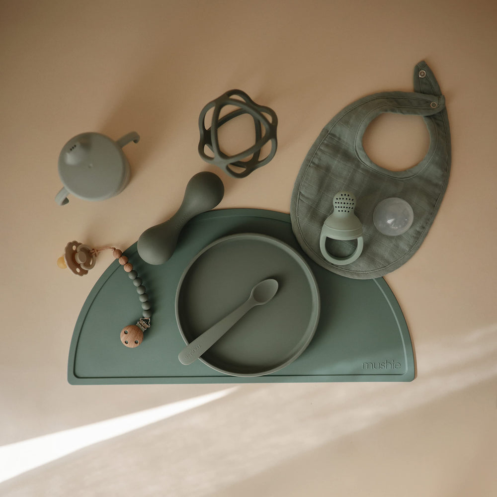 Mushie Eva clip care: hand wash with warm soap for maintenance
