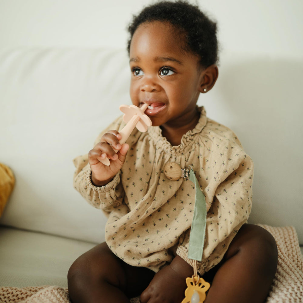 Mushie pacifier clip water-resistant coating suits daily adventures