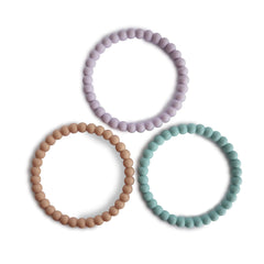 Mushie Pearl Teether Bracelet lilac closeup soothing gums with soft silicone beads