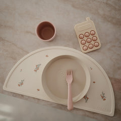 Mushie placemat in Sweden-inspired design, adds timeless elegance to kid's dining.