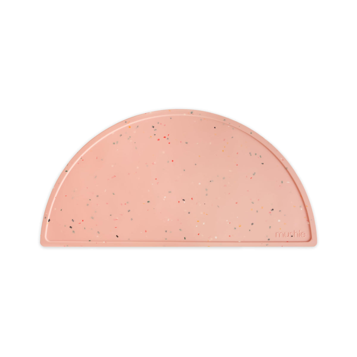 Mushie powder pink confetti placemat pattern closeup highlighting playful design and color.