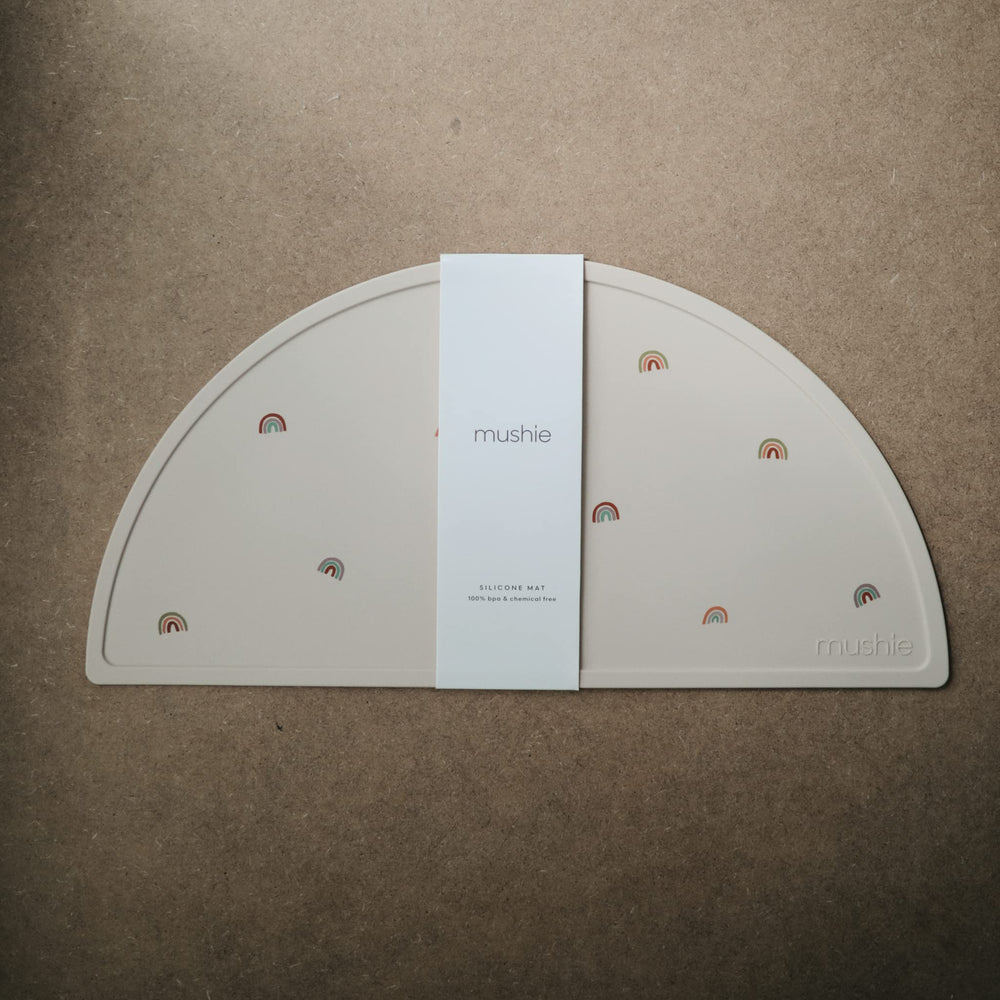 mushie rainbows placemat closeup-silicone highlights smooth texture and BPA-free safety