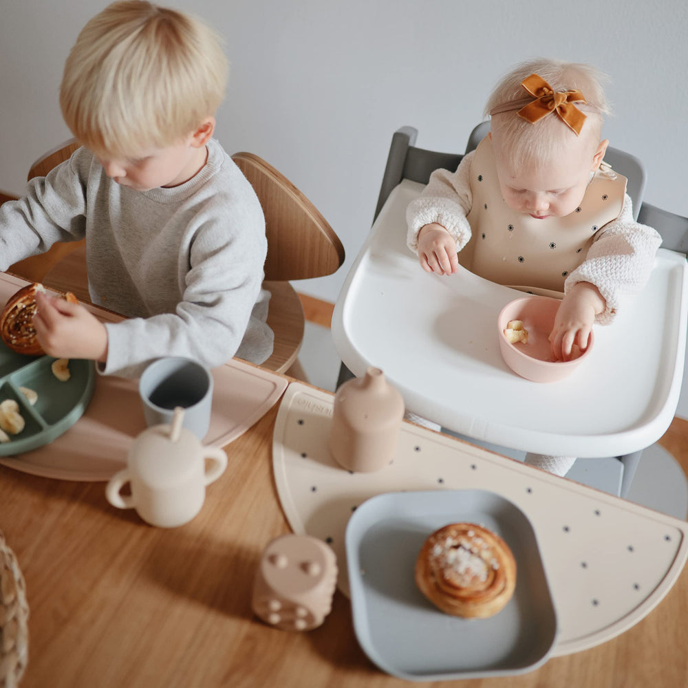 mushie rainbows placemat dishware-pairing promotes coordinated dinnerware for a stylish table