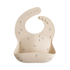 Mushie silicone baby bib with adjustable fit and bees pattern for mess-free meals