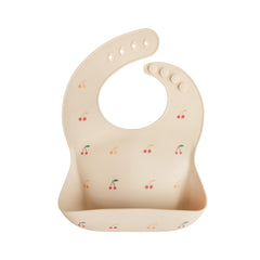 Mushie silicone baby bib adjustable neck cherries for a snug, mess-ready fit.