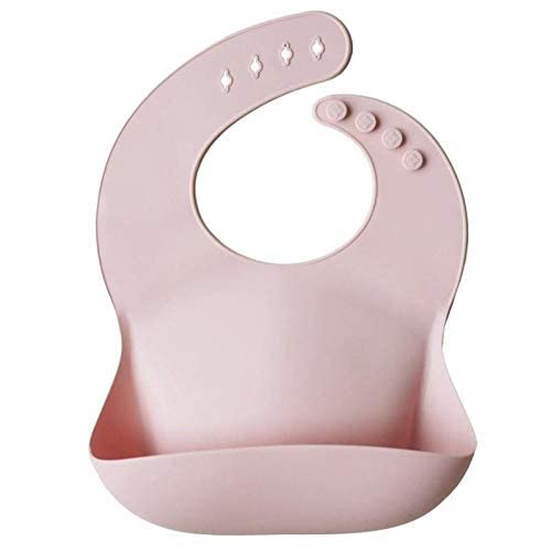 Mushie blush bib showcases a stain-resistant silicone surface for quick wipe-downs.