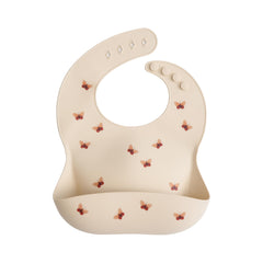 Mushie silicone baby bib butterflies closeup shows soft material for mess-prone meals