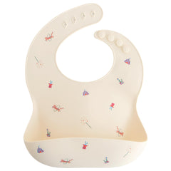 Mushie silicone baby bib circus pattern with adjustable fit keeps clothes clean during meals.
