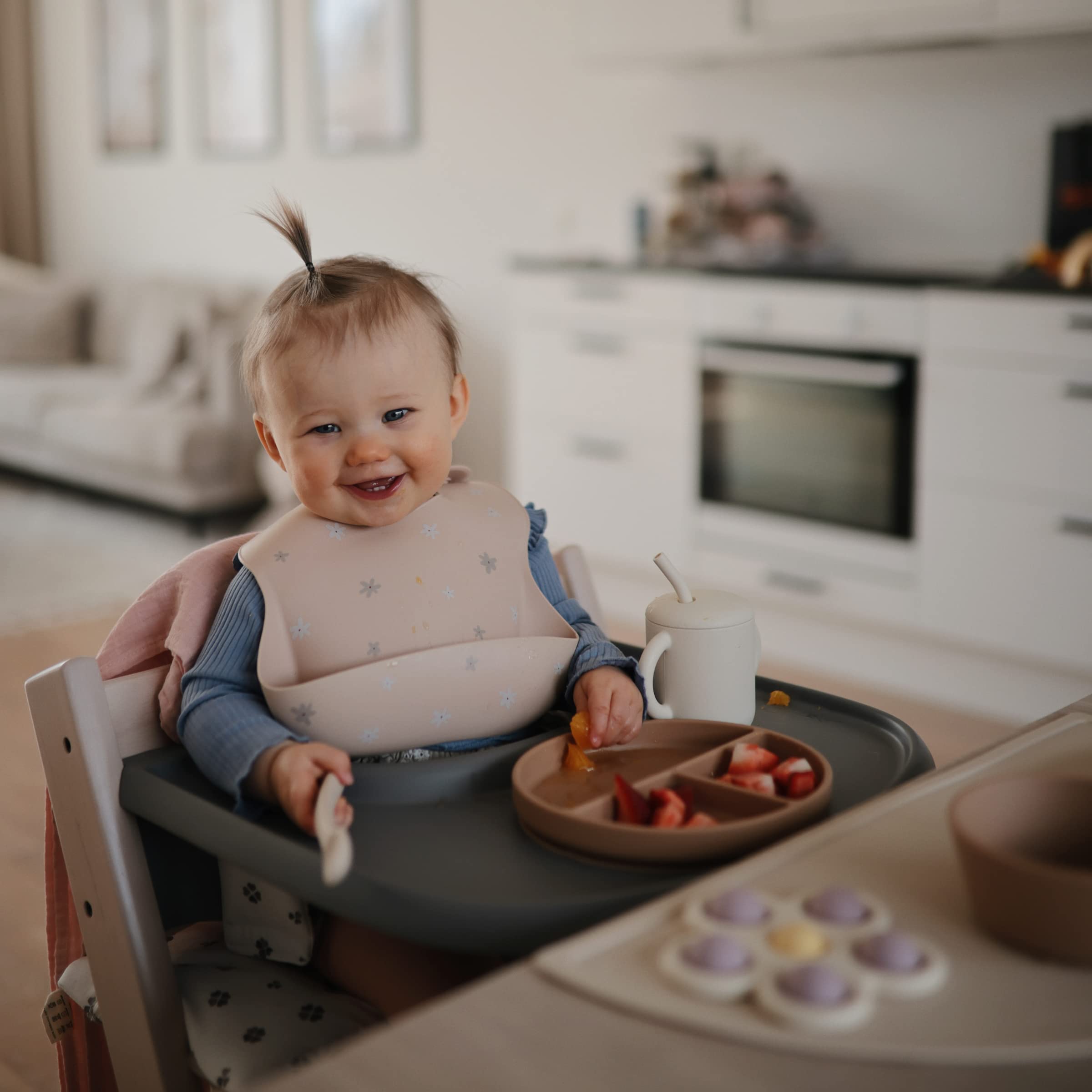 Mushie silicone Daisy bib is BPA-free and safe for busy families.