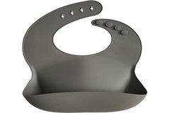 Mushie silicone baby bib easy clean resists stains for quick post-meal cleanup.