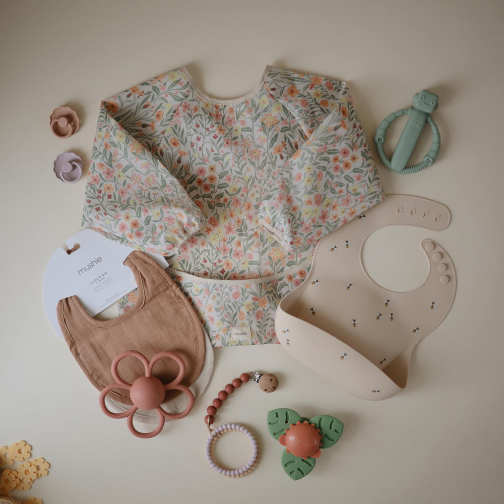 Mushie bees bib stays put during lively feeding sessions