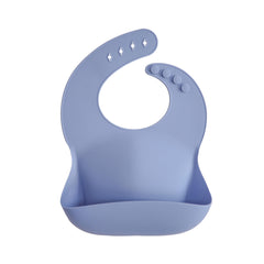 Mushie silicone baby bib powder blue front view showing deep pocket for mess control
