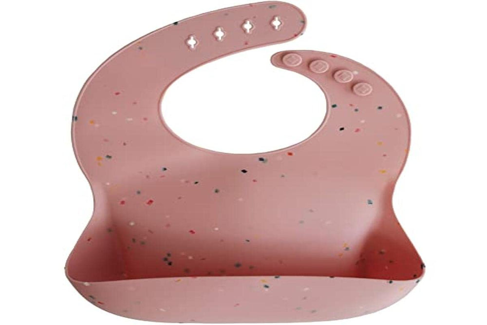 Mushie silicone baby bib powder pink confetti stain-resistant surface stays cleaner