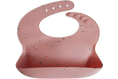 Mushie silicone baby bib powder pink confetti stain-resistant surface stays cleaner