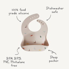 Mushie silicone baby bib Pretzel neck fasteners provide snug adjustable fit for growing babies.