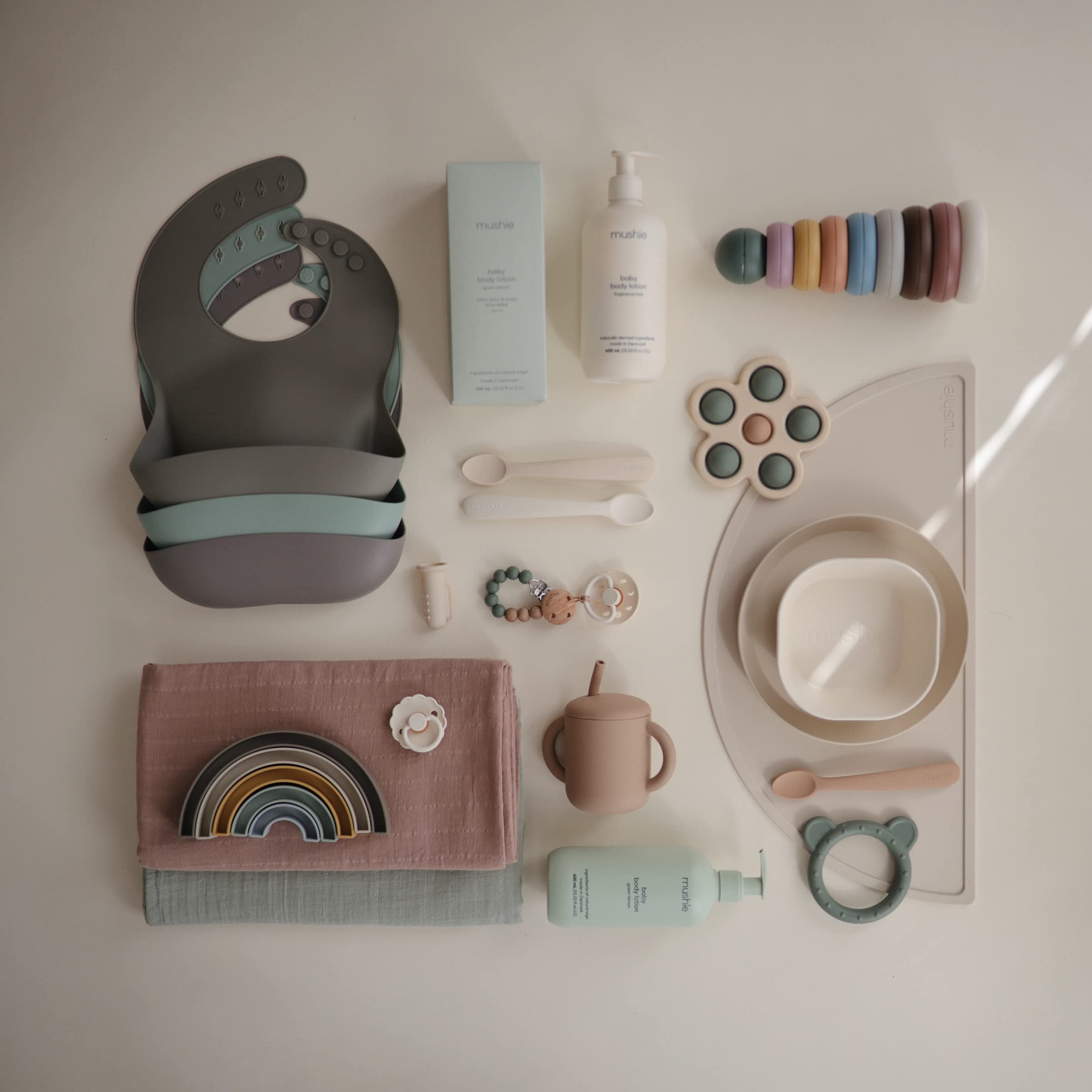 Mushie Silicone Baby Bib Silver Sage is compact for travel and easy to store.