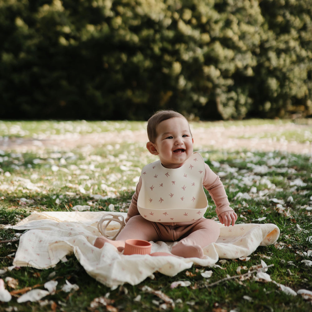 Mushie silicone bib showcasing soft texture gentle on delicate skin