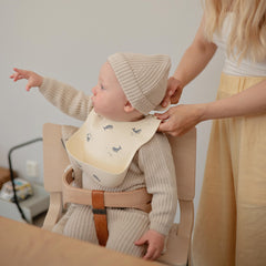 Mushie silicone baby bib Sweden-design reflects timeless style during meals
