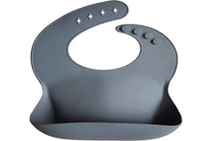 Mushie Tradewinds BPA-free bib supports safe feeding with skin-friendly silicone.