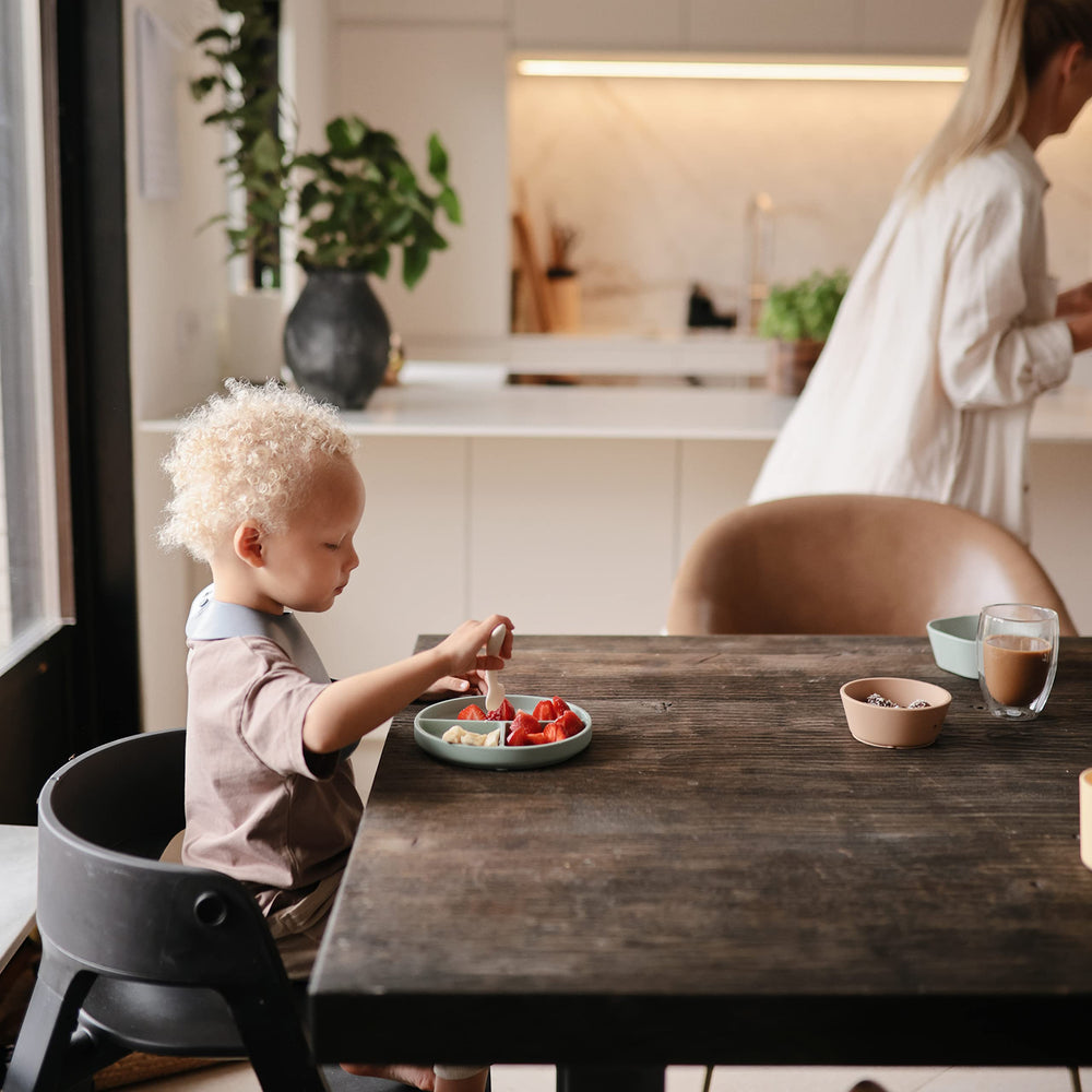 Mushie Tradewinds bib with soft texture feels gentle on skin at meals.