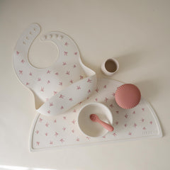 Mushie waterproof silicone bib resists stains for easy daily cleanup