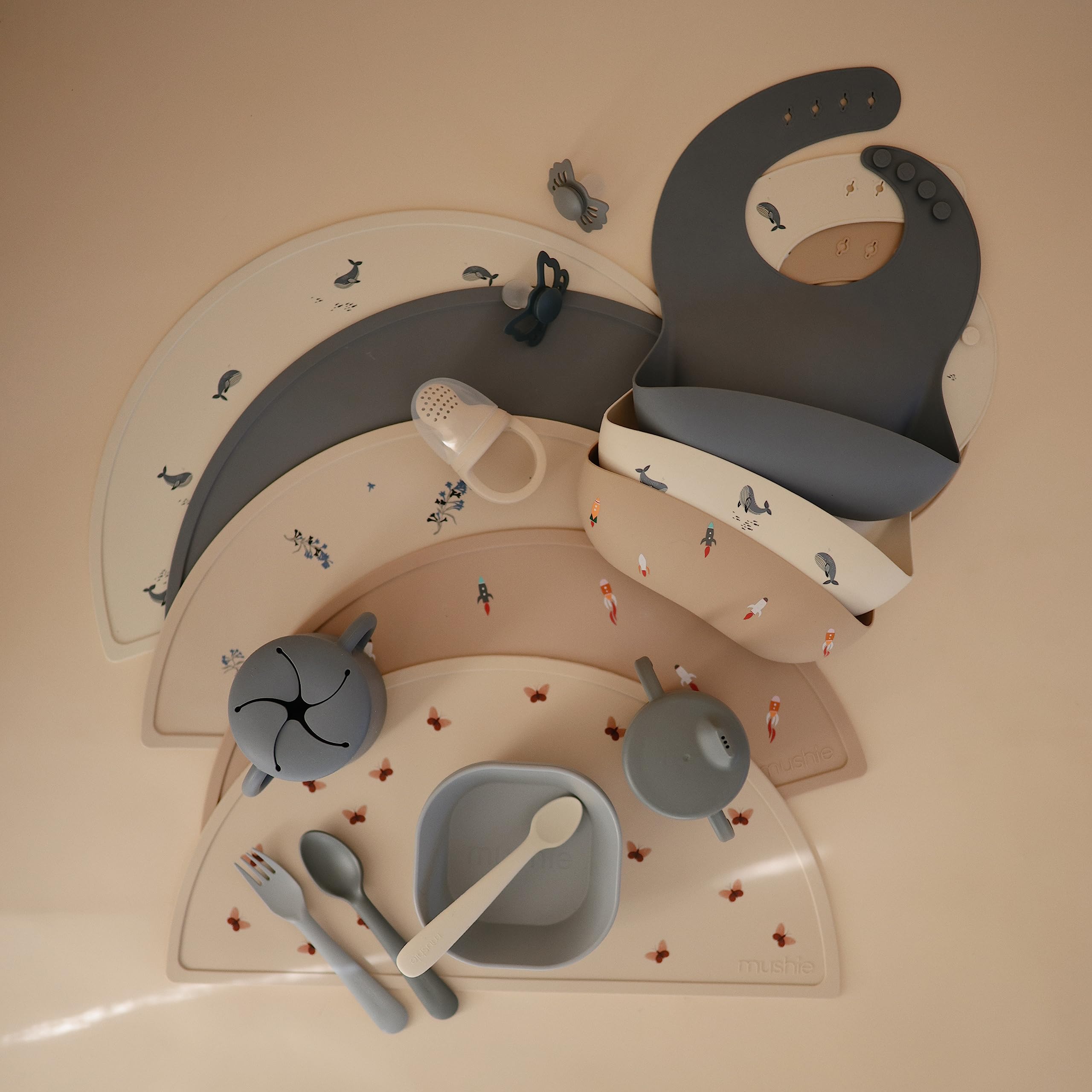Mushie silicone baby bib whales-pattern adds playful charm to feeding time