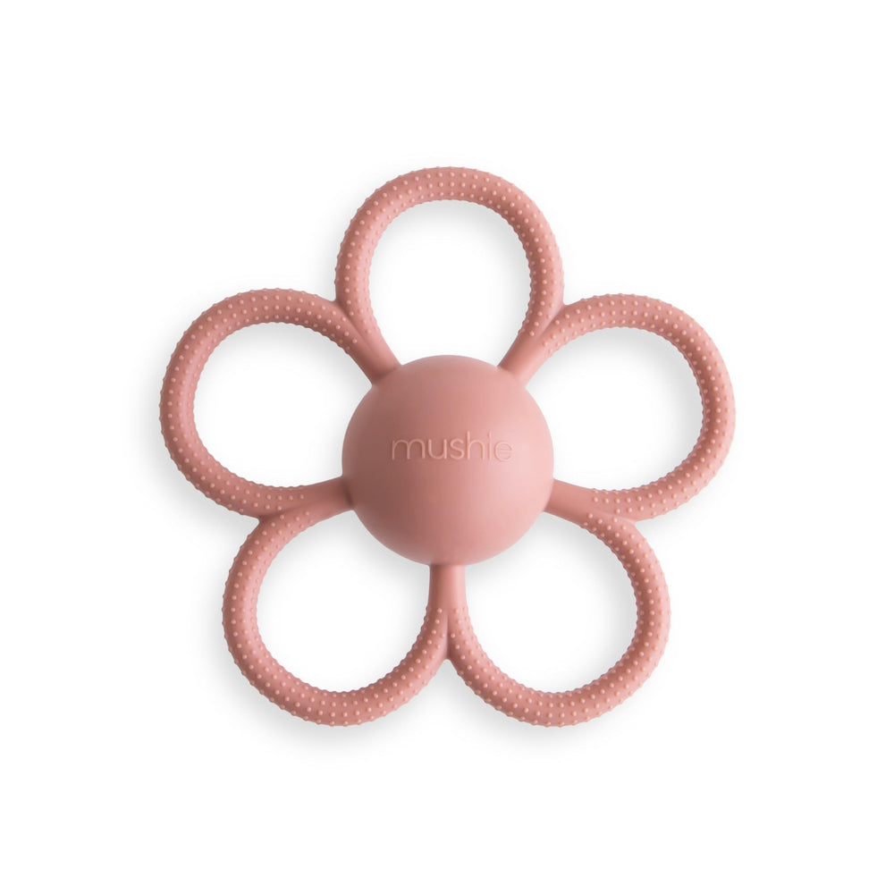 Mushie Daisy Rattle Teether dusty-rose front view supports sensory exploration.
