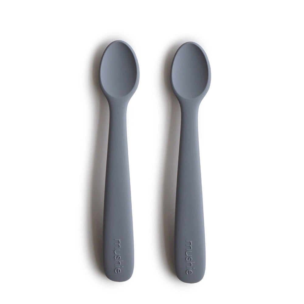 Mushie silicone baby feeding spoons Tradewinds soft-tip protects delicate gums during meals.