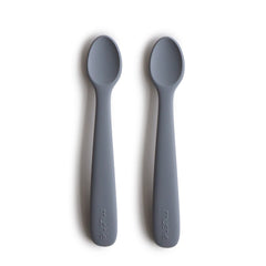 Mushie silicone baby feeding spoons Tradewinds soft-tip protects delicate gums during meals.