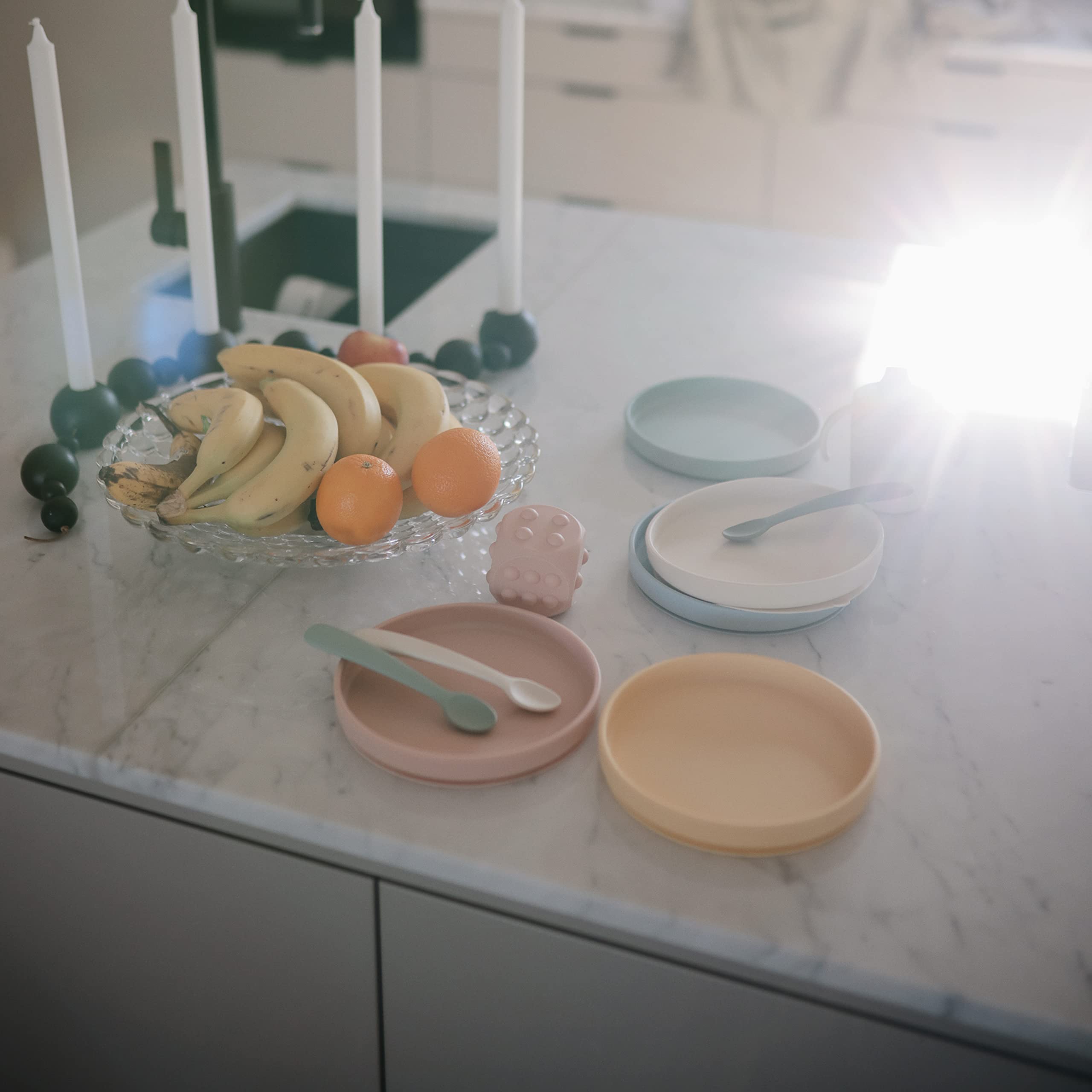 Mushie silicone baby feeding spoons wipe-clean design for quick after-meal cleanup.